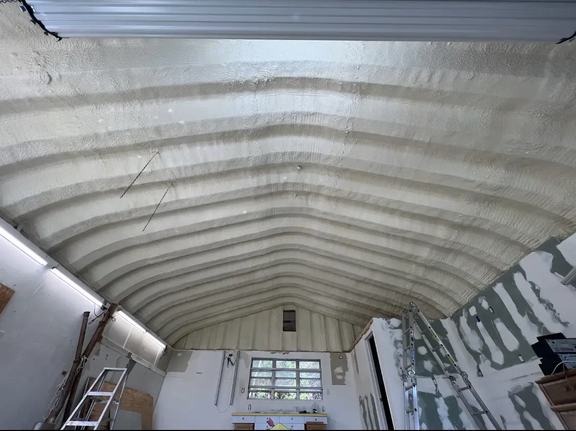 Spray polyurethane foam applied to the underside of a metal roof deck in Wailea